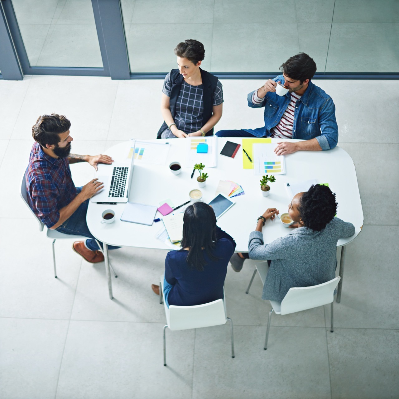 Engineering and business team meeting to discuss product integration and development planning