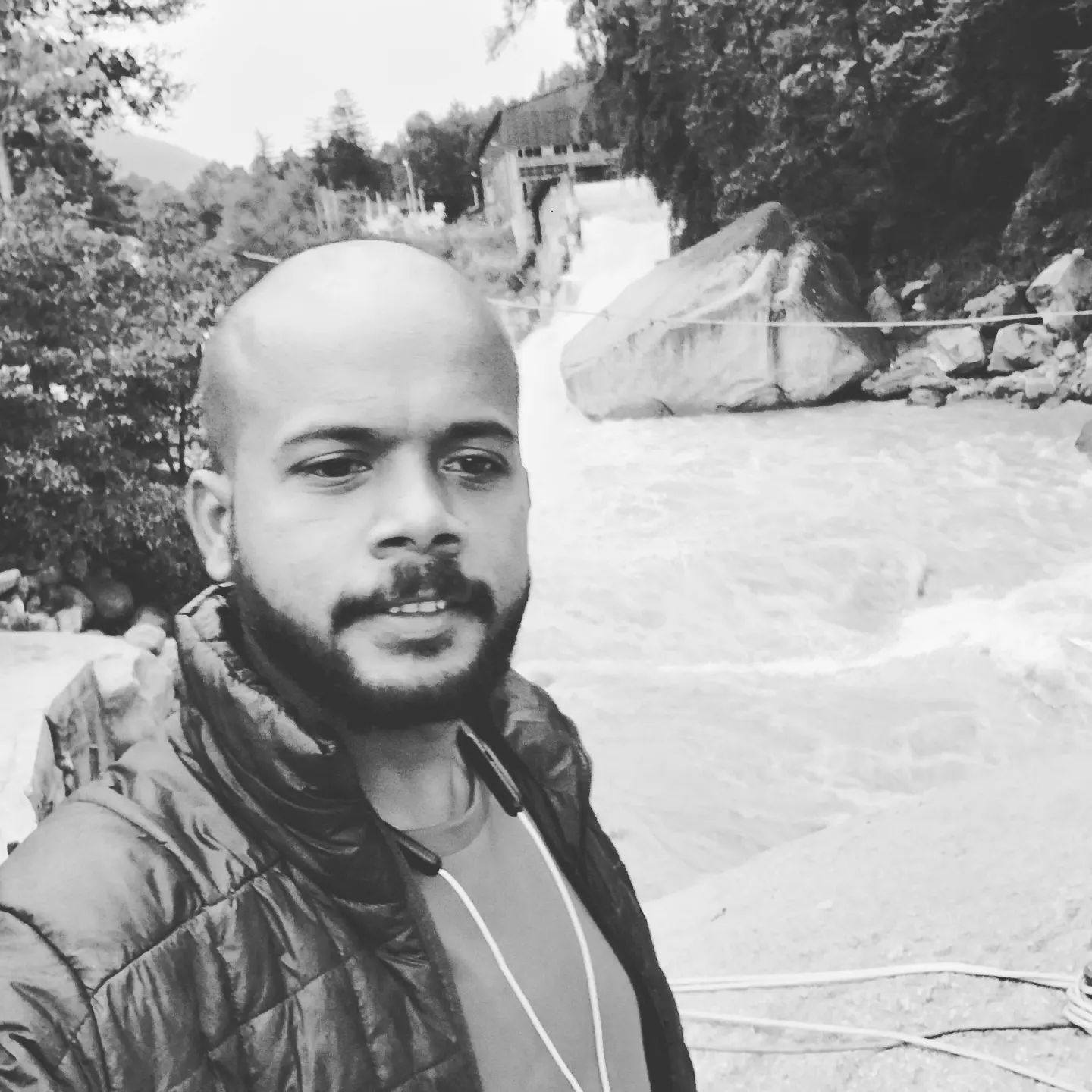 Founder of Rightbrainz media solutions a man with a beard and a beard in a black and white photo