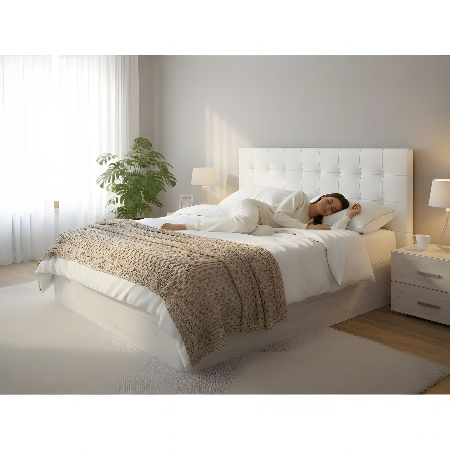 a woman laying on her bed in a bedroom