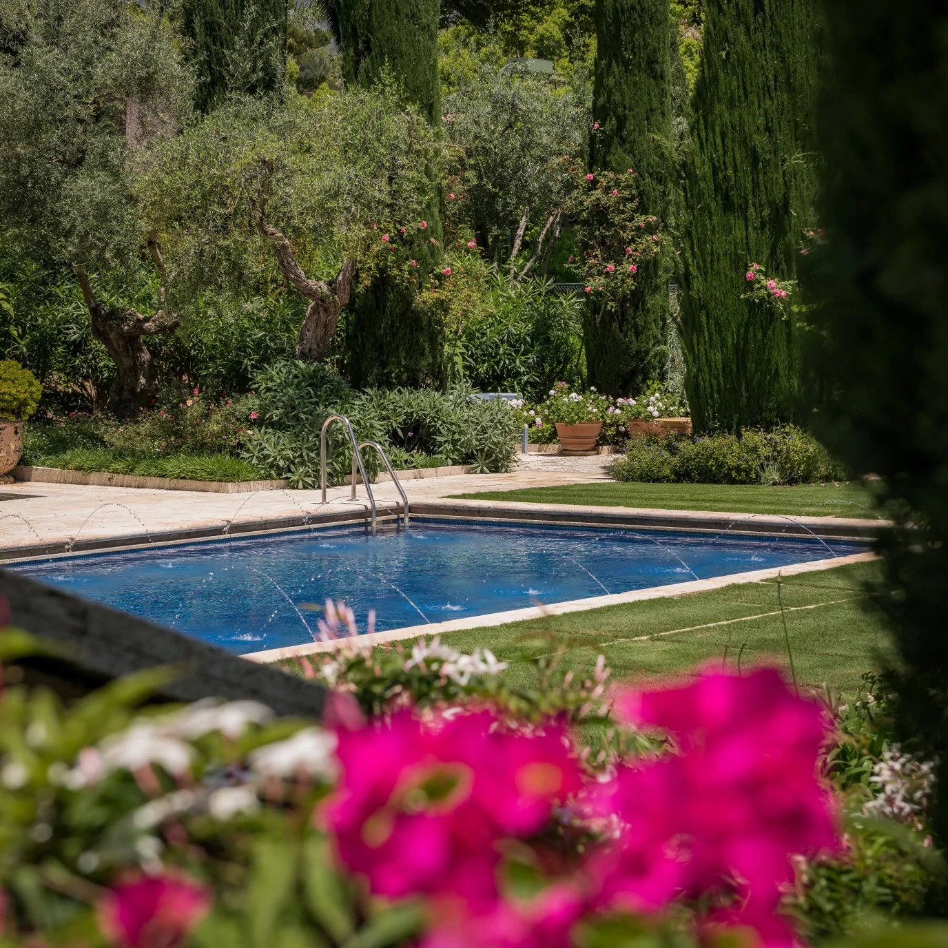 Swimming pool surrounded by landscaped gardens in Marbella