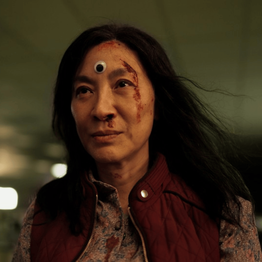 a man and woman sitting on a car