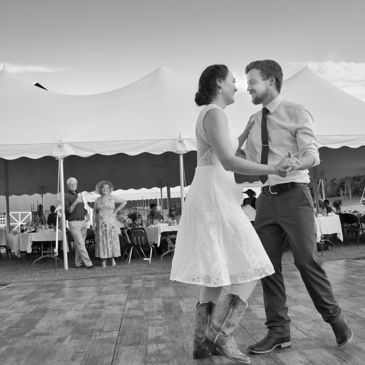 a bride and groom dancing in the outdoor wedding