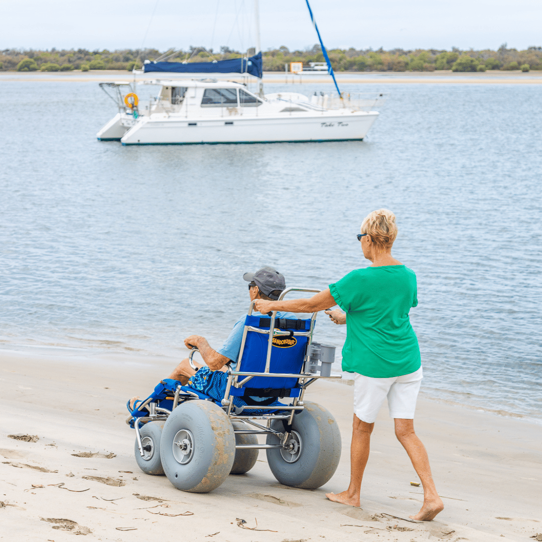 Using a beach wheelchair in the beach in Thailand. Making our beach accessible.