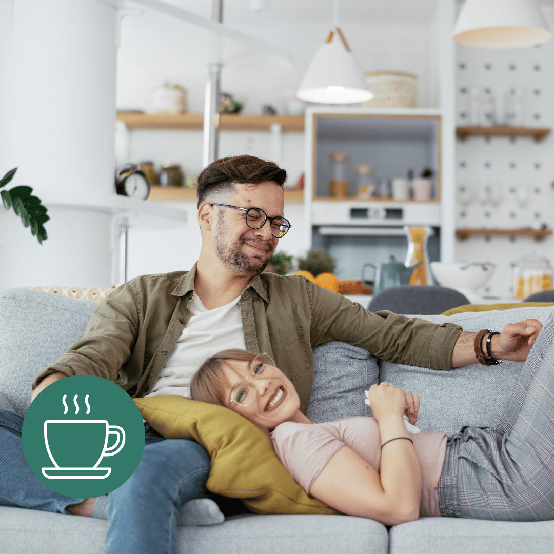 a man and woman sitting on a couch