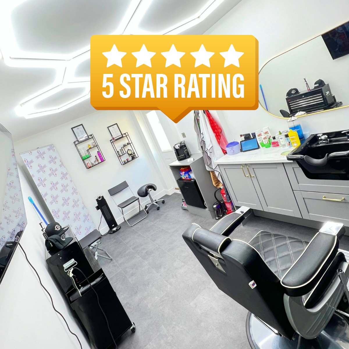 Interior of YAU Barber Studio featuring modern barber chairs, clean setup, and a 5 star rating badge.