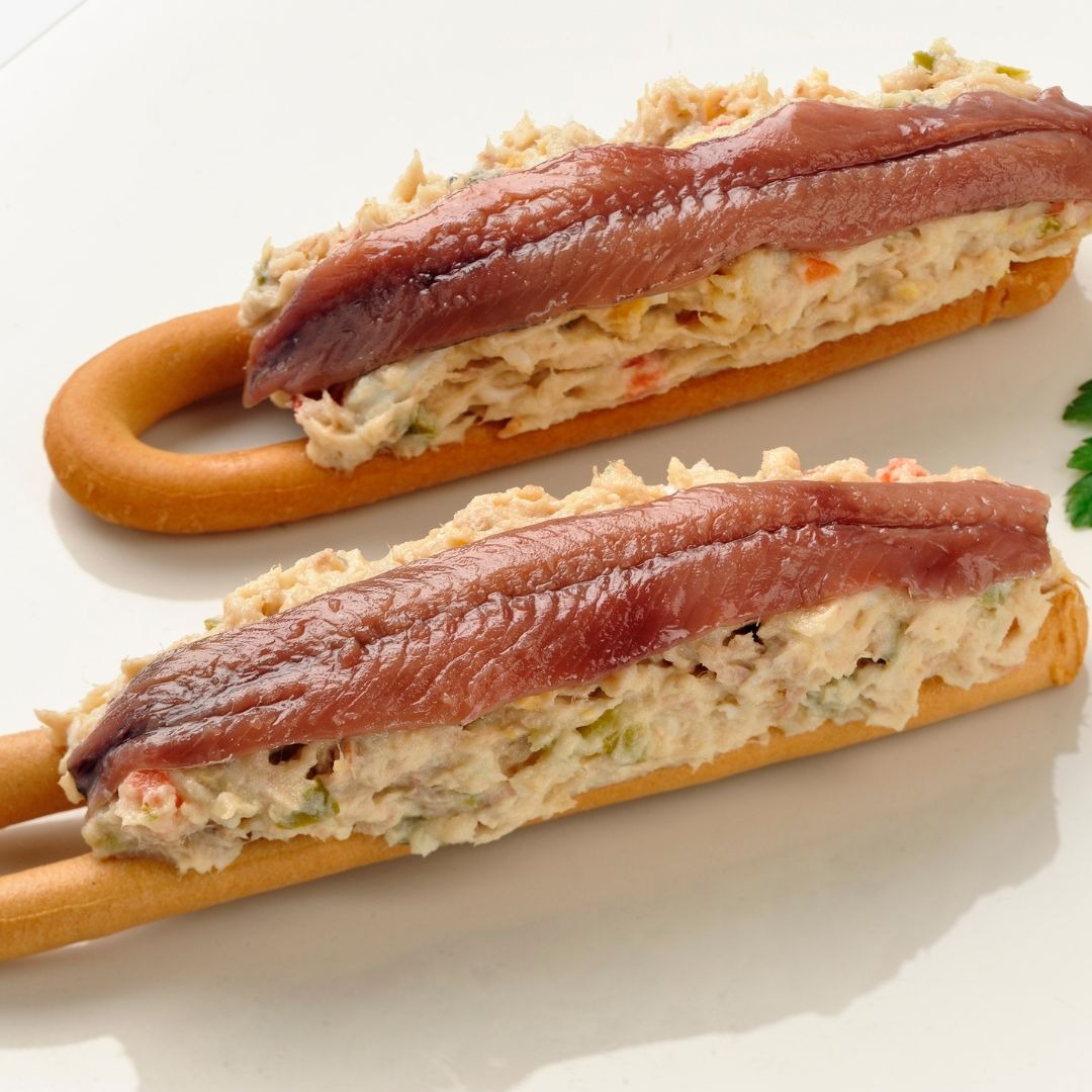 The "marinera" is a tapa consisting of Russian salad on a crispy, salted doughnut, topped with an an