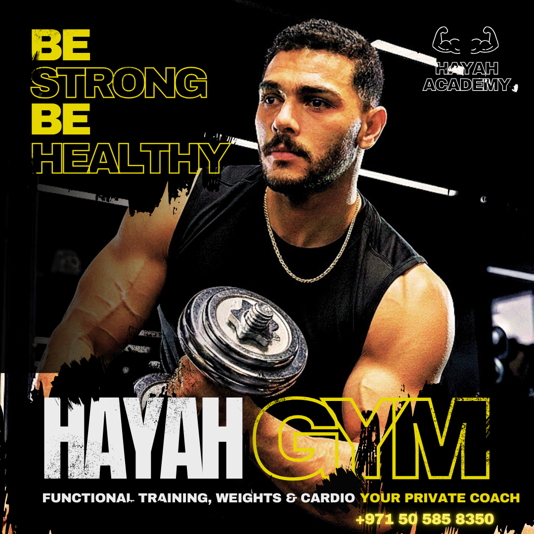 Athletic man lifting weights at Hayah Gym, featuring functional training and private coaching services.