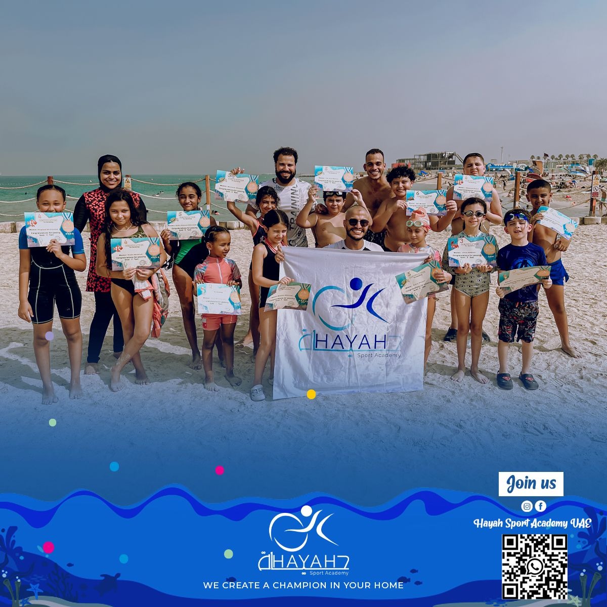 Our students holding certificates at Hayah academy Sport Academy beach swimming camp in the UAE.