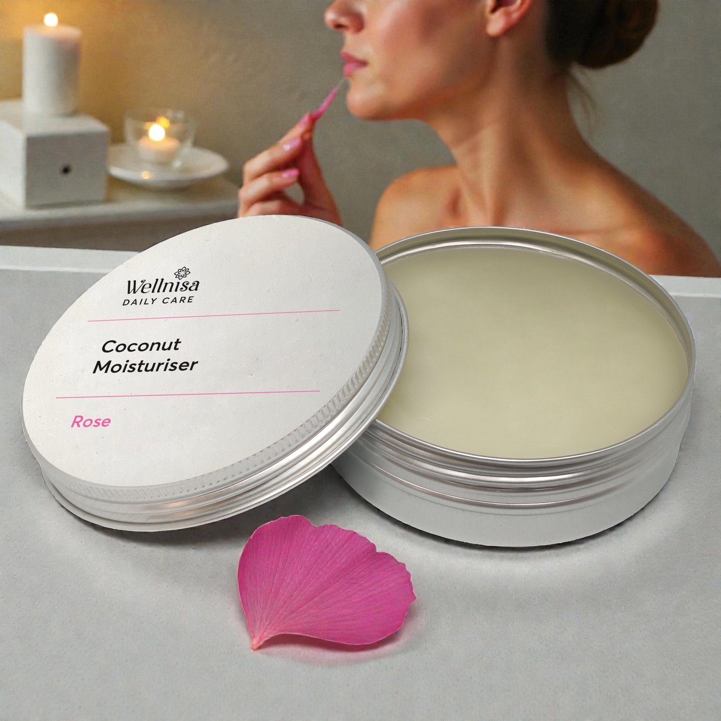 Wellniz natural lip care: applying small amount of Coconut Rose Moisturizer to lips, close-up finger