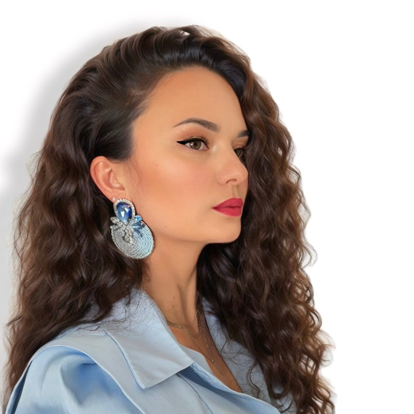 a woman with long hair and earrings on her earrings