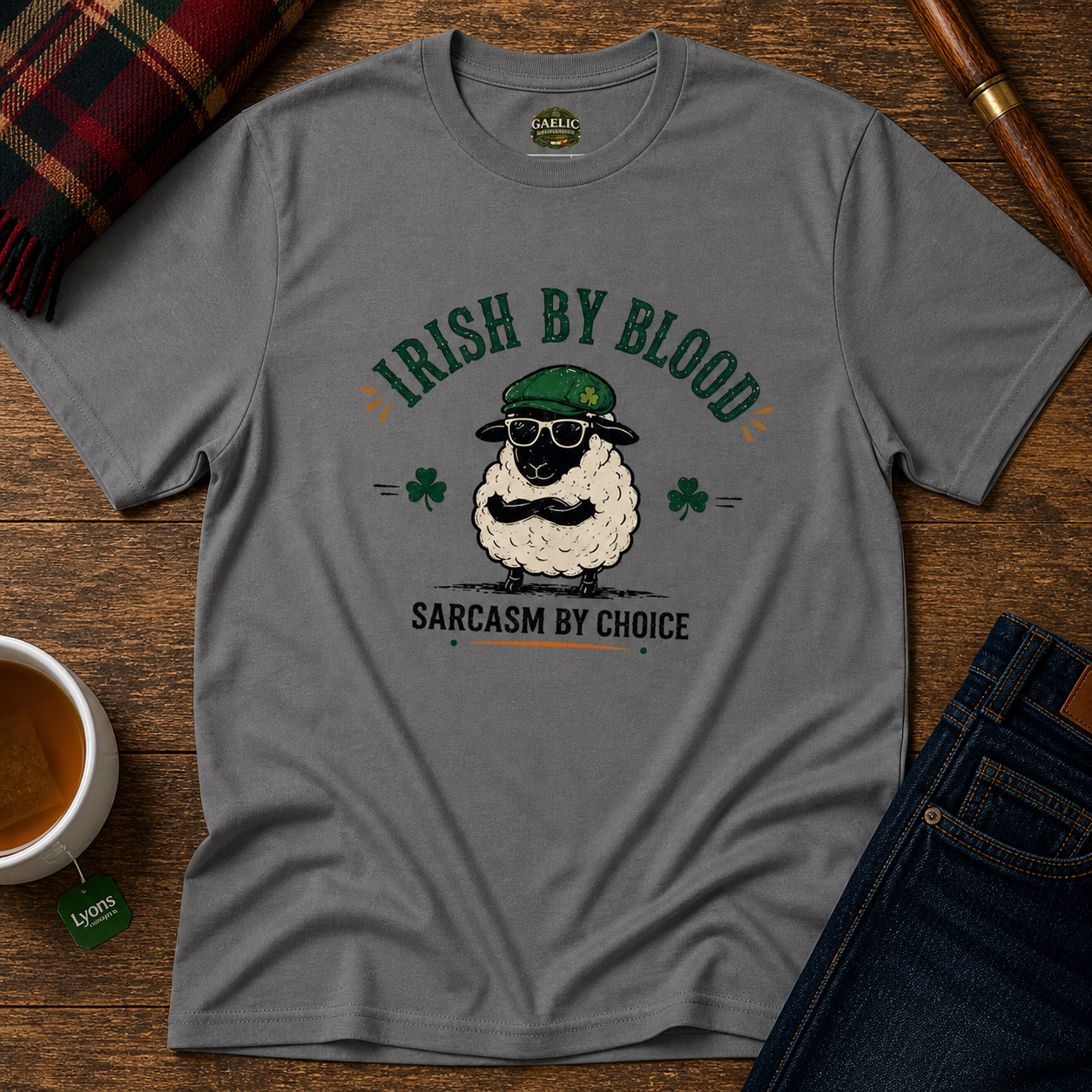 Grey Irish By Blood sarcasm t-shirt featuring a funny sheep wearing a green hat and sunglasses.