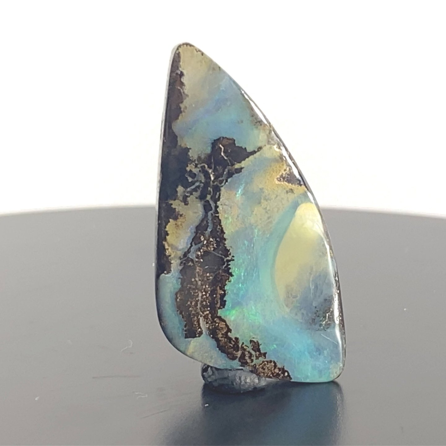 Stunning blues and greens amongst Ironstone. Queensland Boulder Opal from Australia.