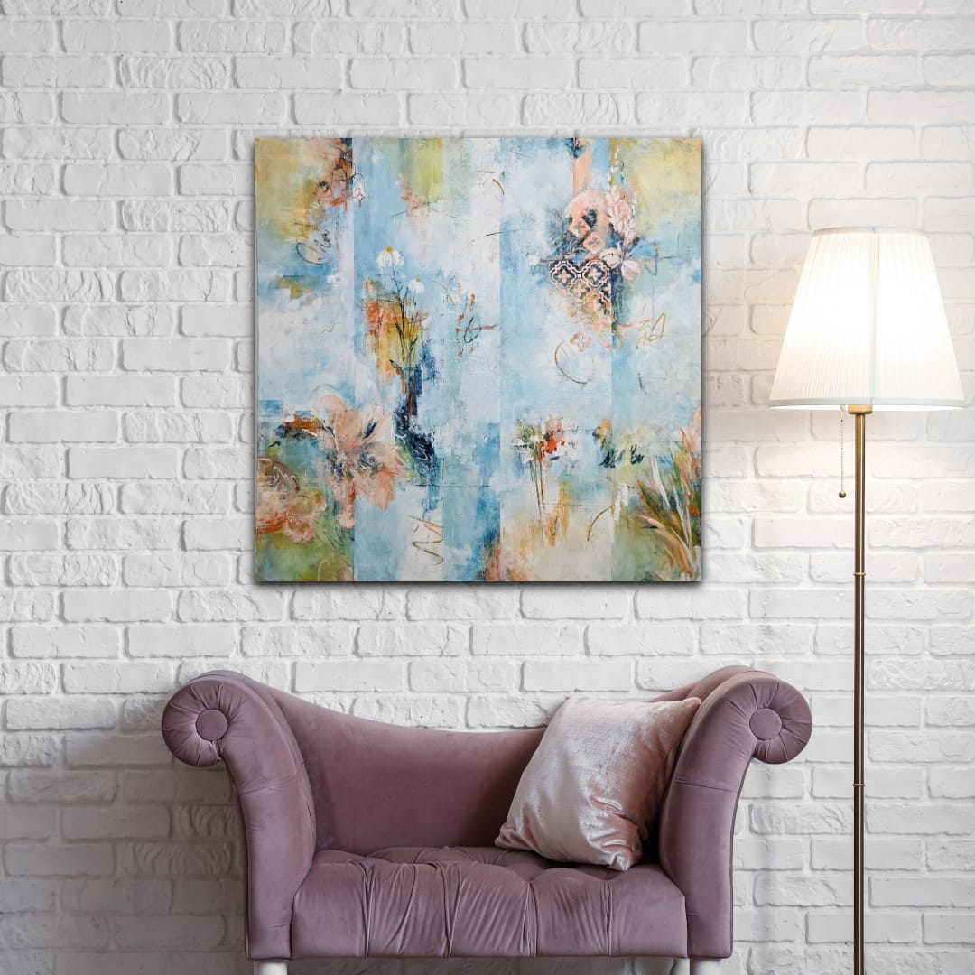 Modern abstract canvas wall art in blue and gold hanging above a purple velvet chaise lounge.