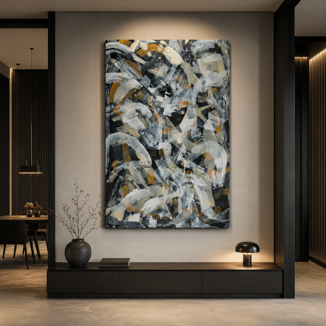 Large abstract wall art in black and gold hanging above a modern console table in a luxury living room.