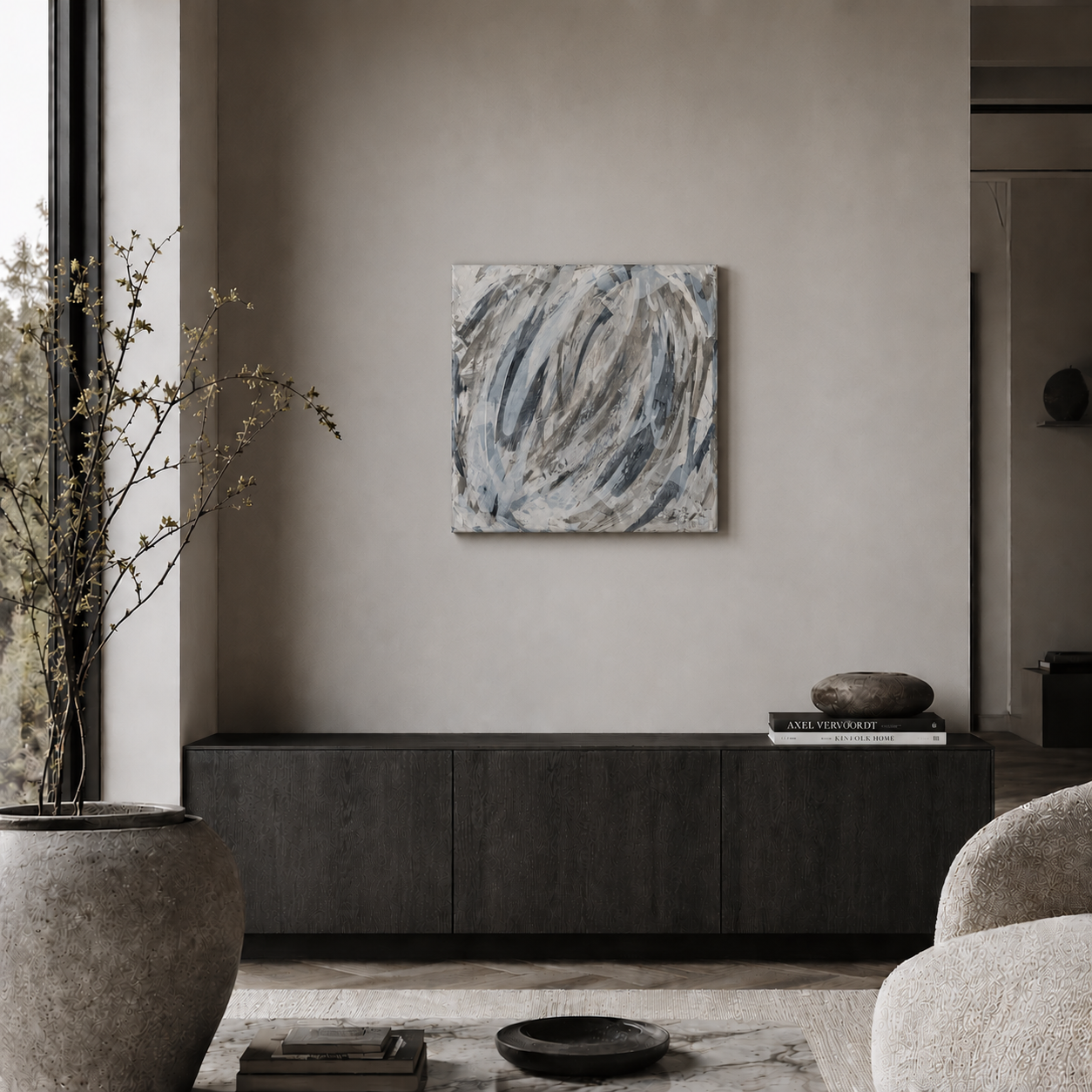 Modern minimalist living room featuring abstract wall art above a dark wood sideboard cabinet.