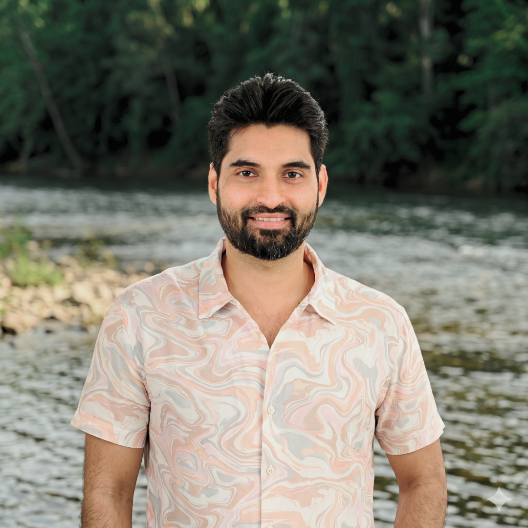 Rohan Fernandes, relationship and intimacy coach at Turtle Balance, smiling in the nature.