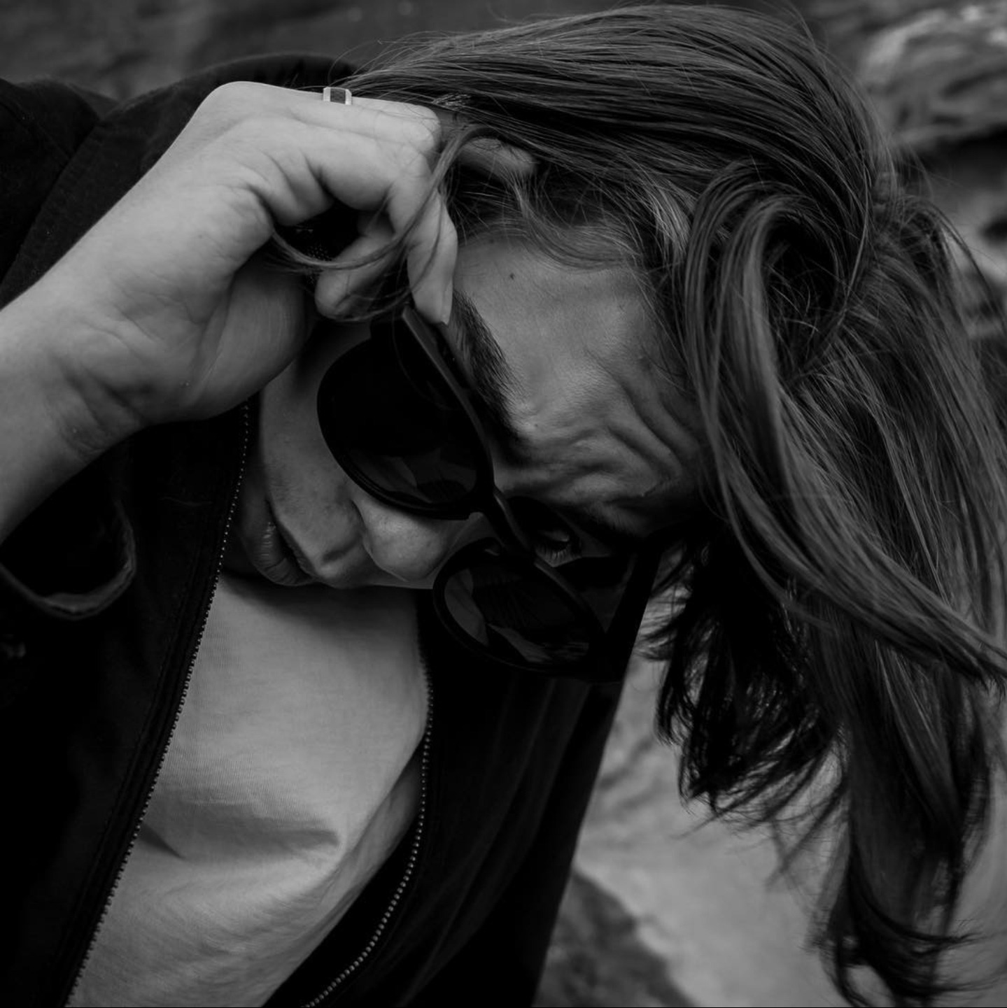 a man with a camera and sunglasses on