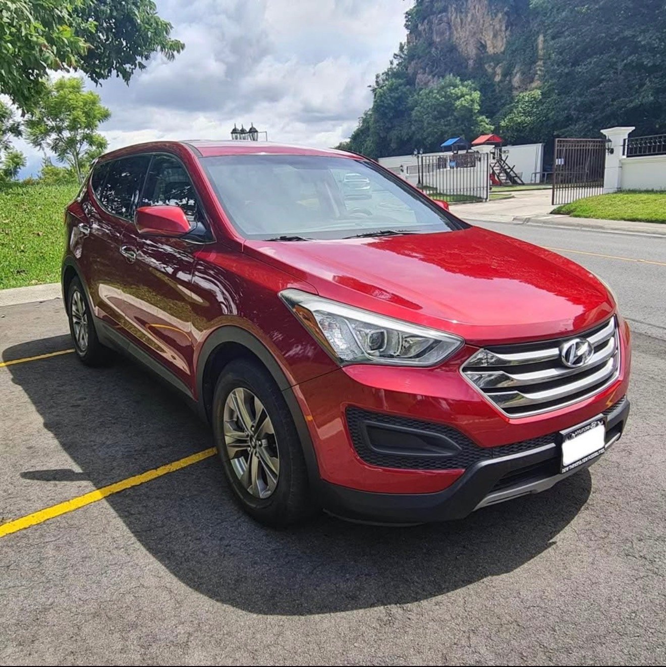 a red car parked in a parking lot
