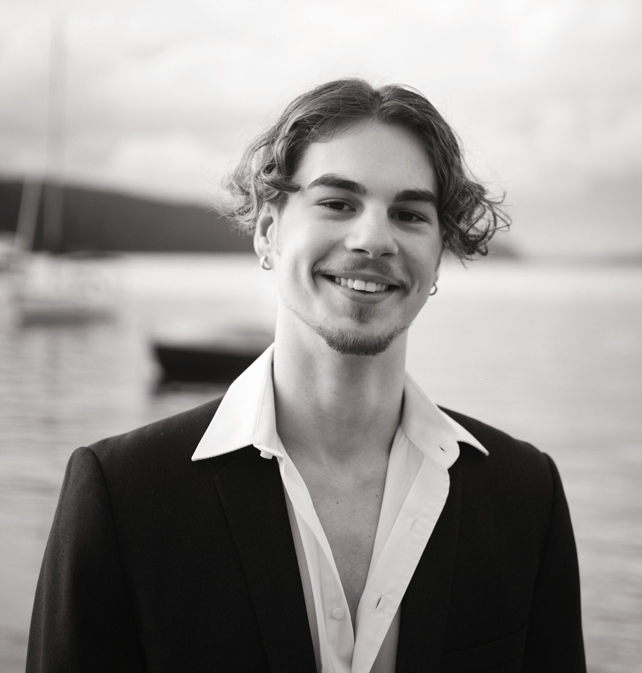 a man in a suit and white shirt