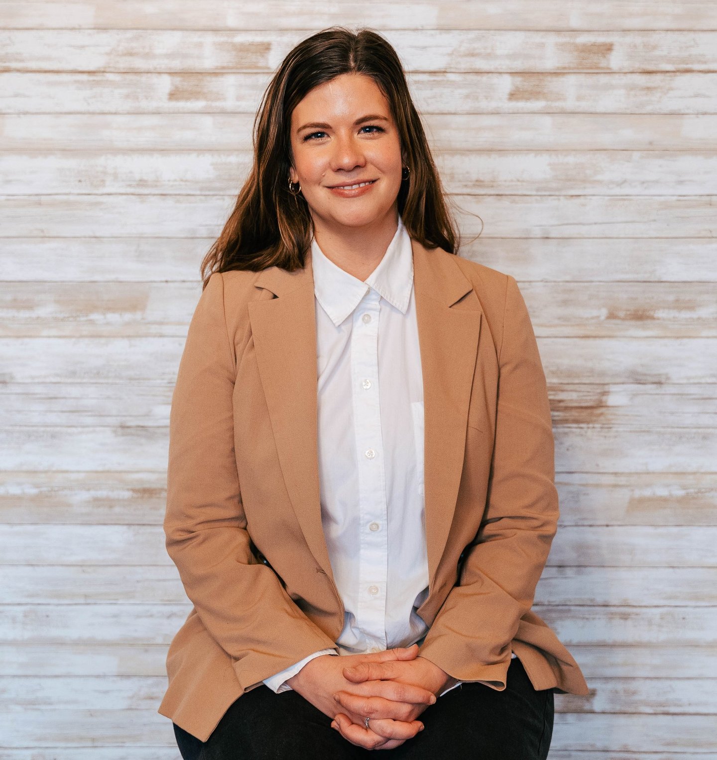 Ariel Weber a social worker and psychotherapist who performs CBT, DBT and ACT smiling 