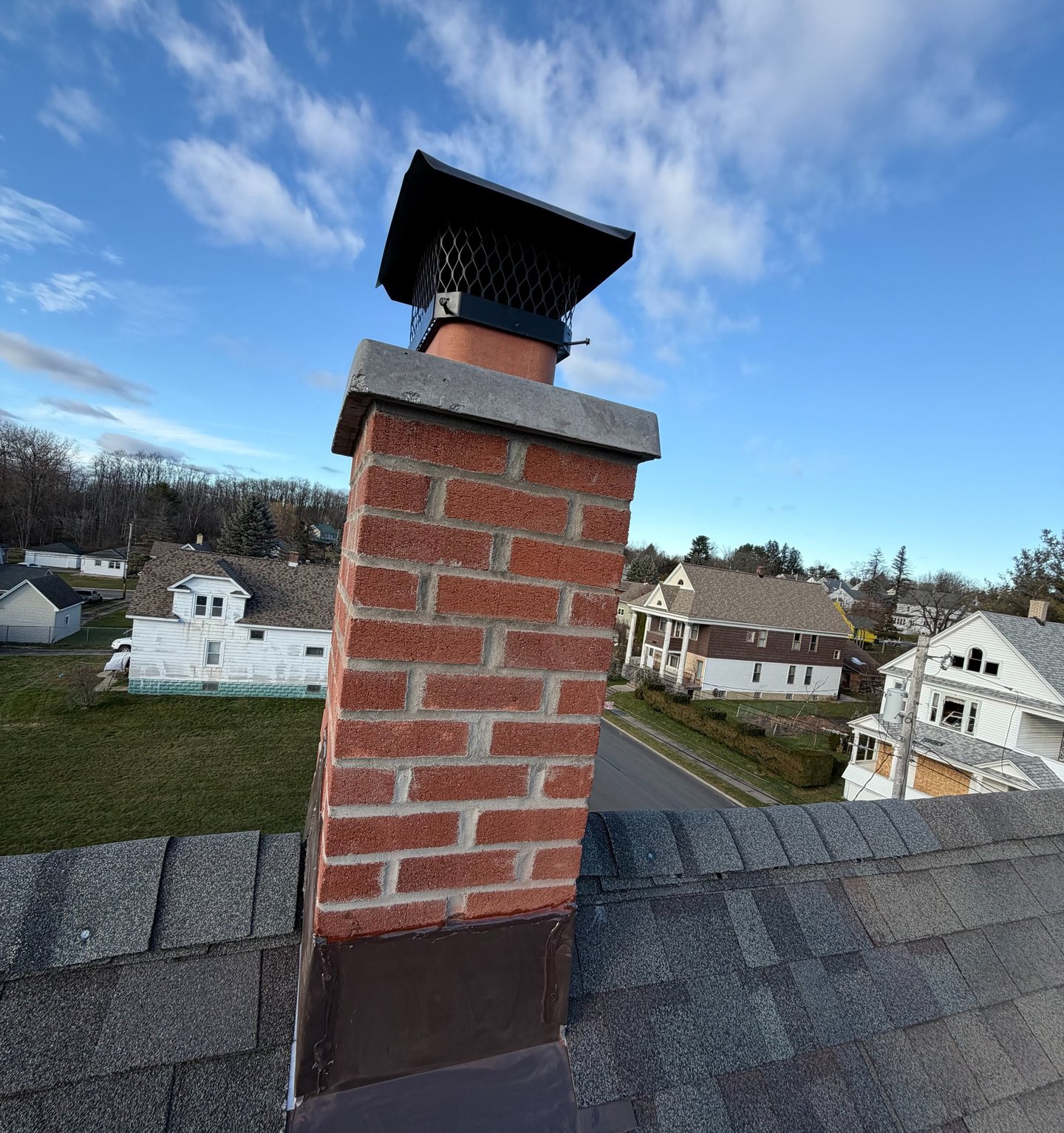 New chimney rebuild from roofline and up with new chimney crown done by Chimney professional 