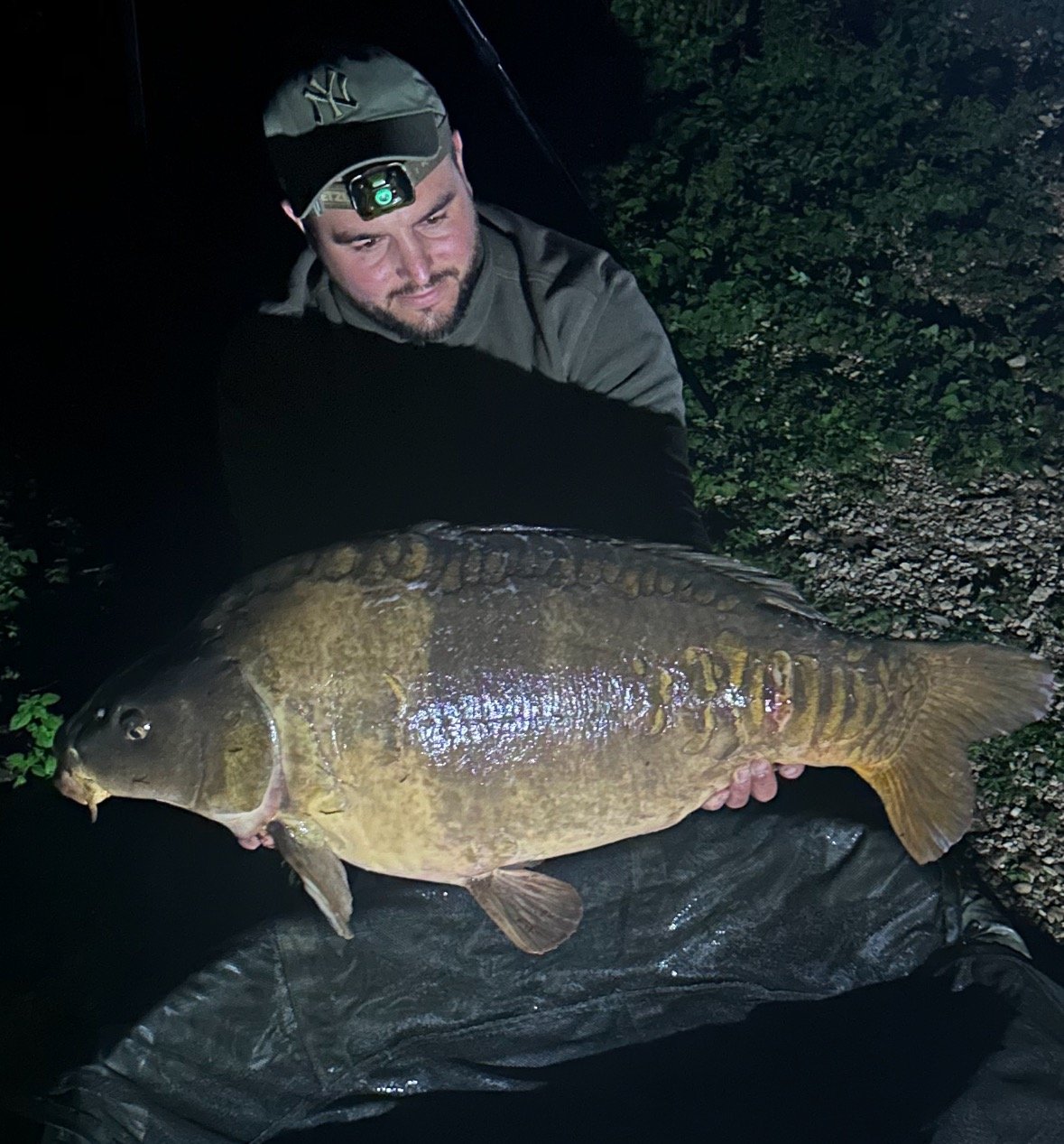 a man holding a fish carp carp carp carp
