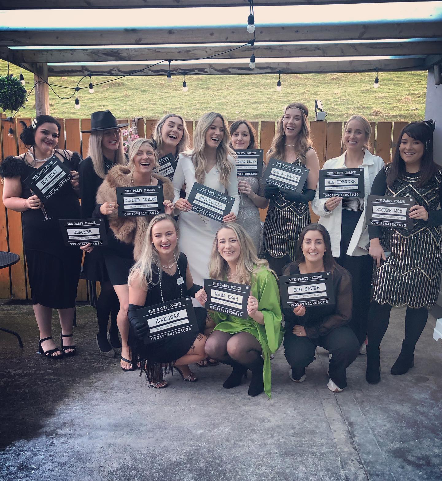 a group of girls at a1920s murder mystery party.