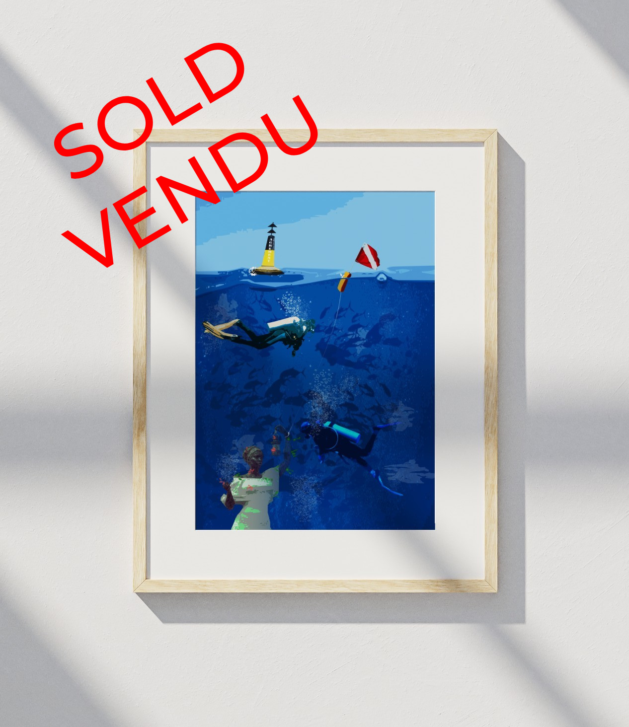Framed underwater scene with scuba divers and statue