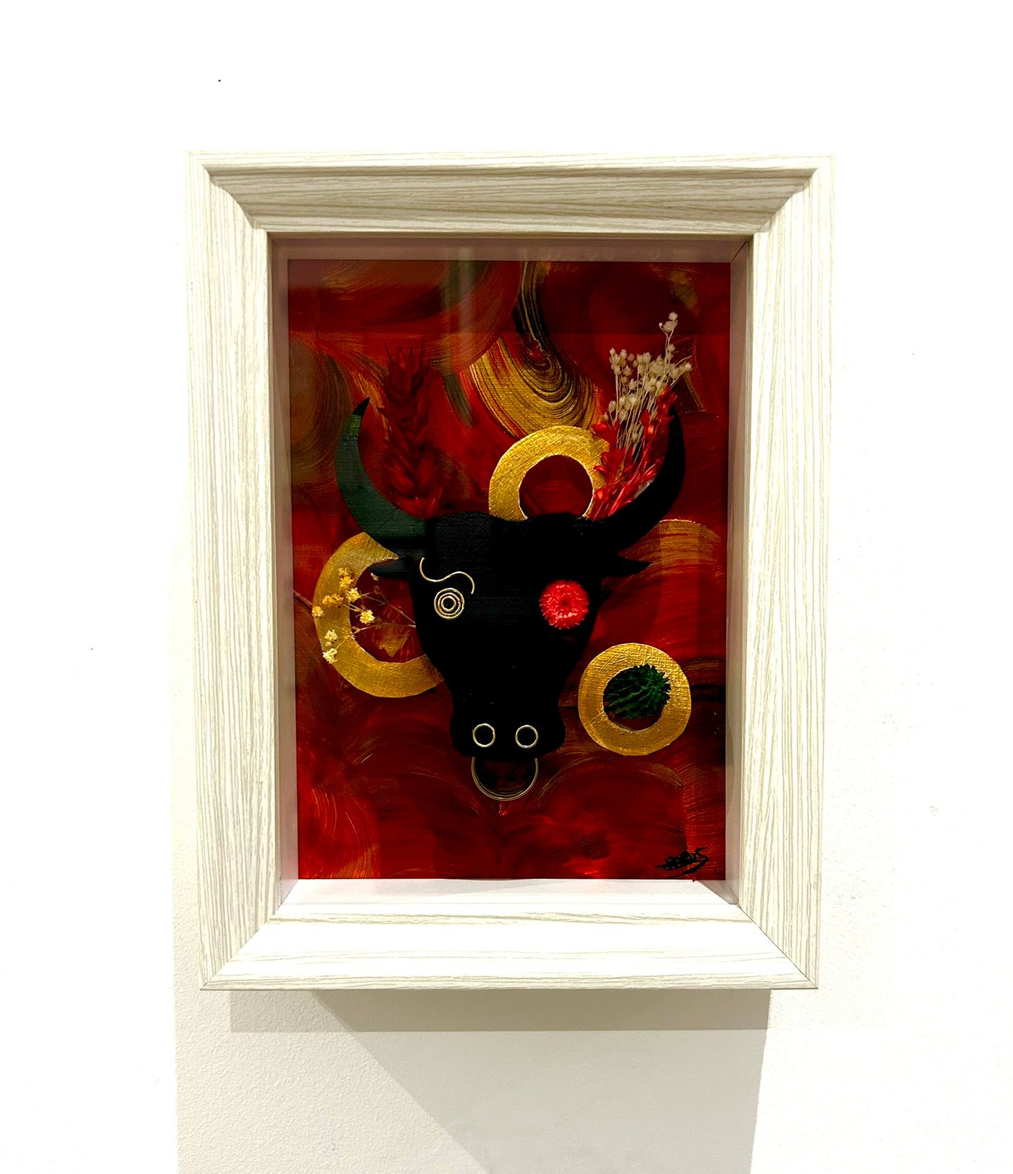 a picture of a bull headdressuck with a red background