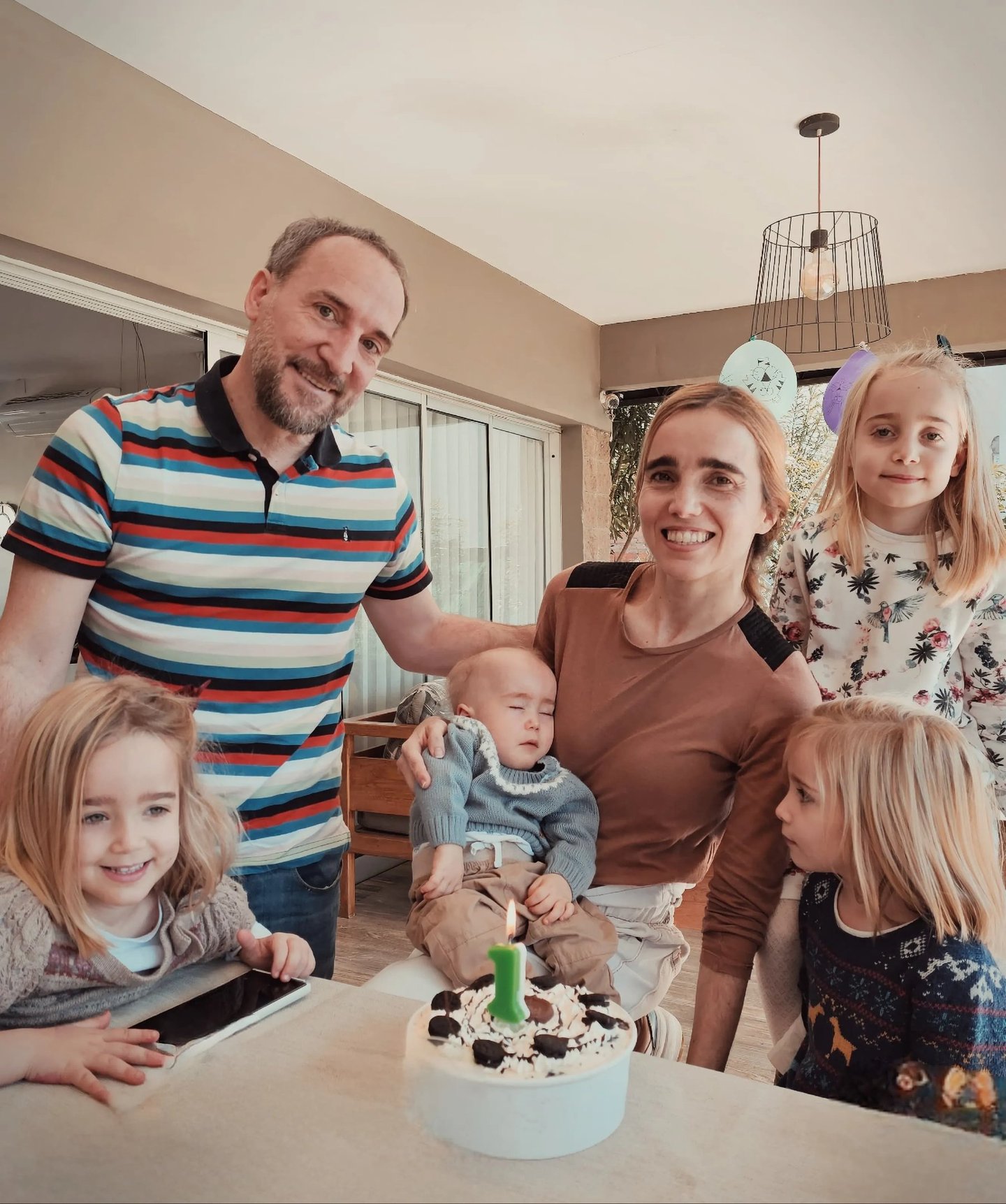 Federico Lix Klett Victoria Pasquini a family of four children and a baby in a kitchen
