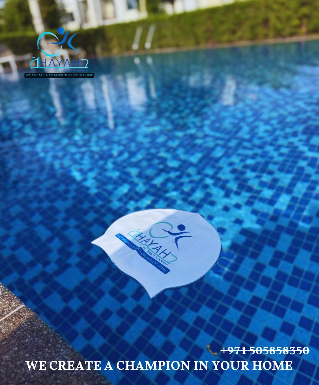 White Hayah7 Sport Academy swimming cap floating in a blue tiled outdoor pool.