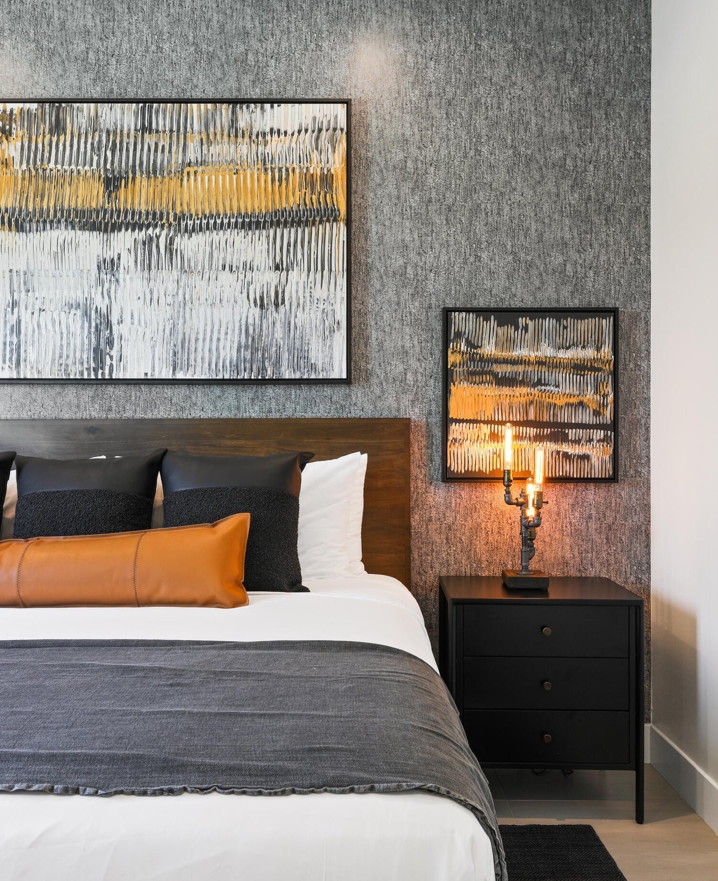 Elegant gray wallpaper accent wall in a modern bedroom, adding texture and sophistication to the space