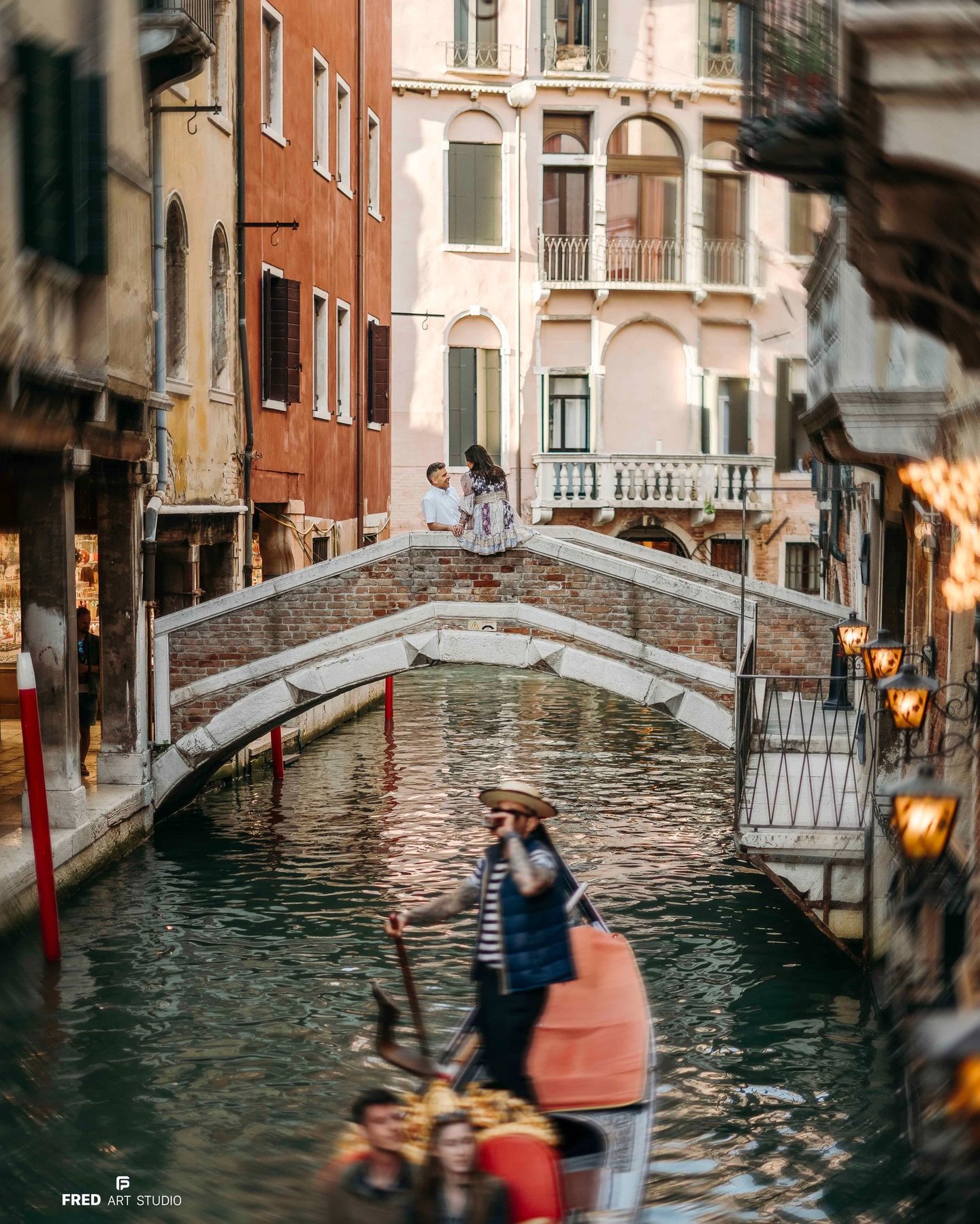 Couple on bridge over Venice canal