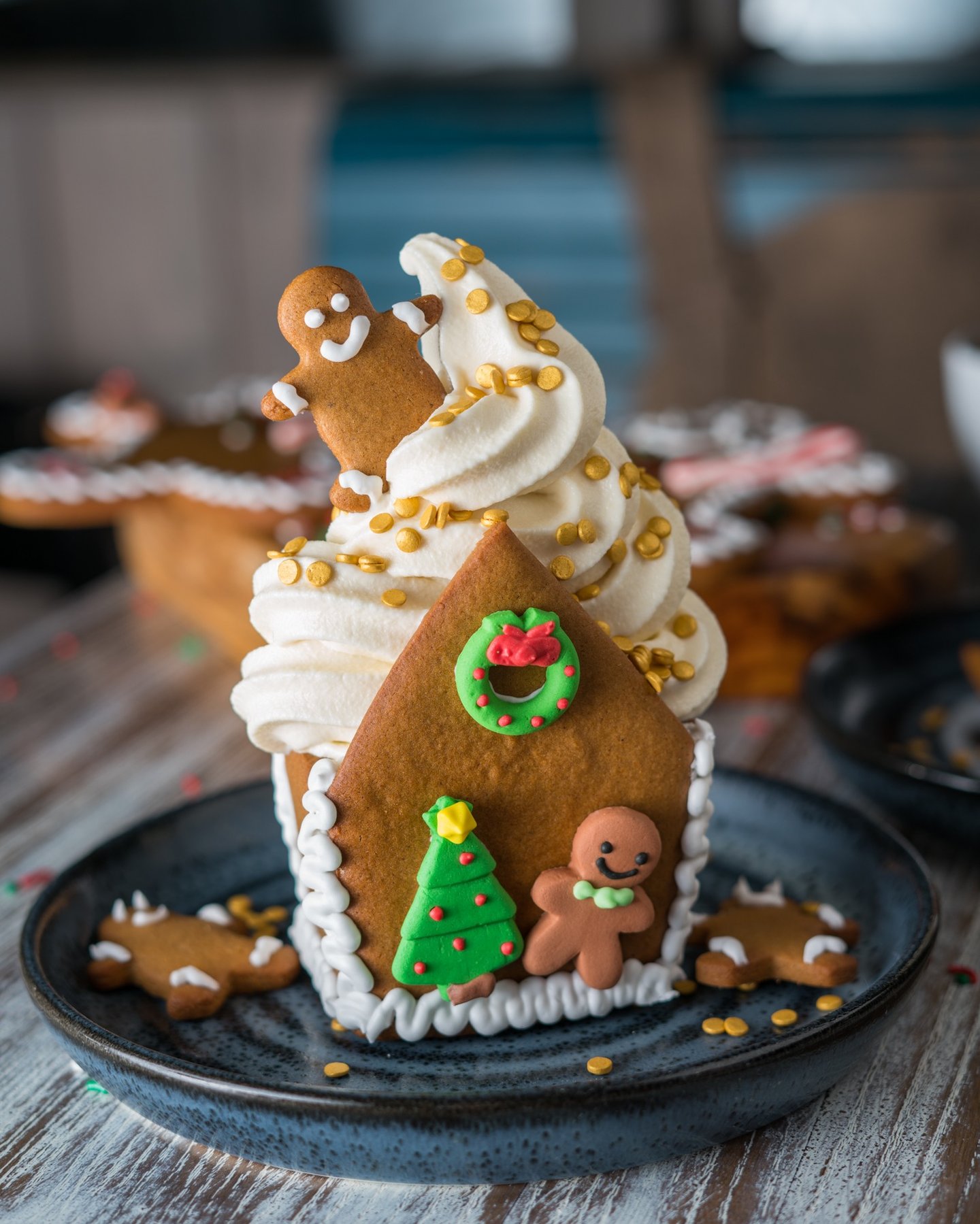 a gingerbread house with soft serve inside 