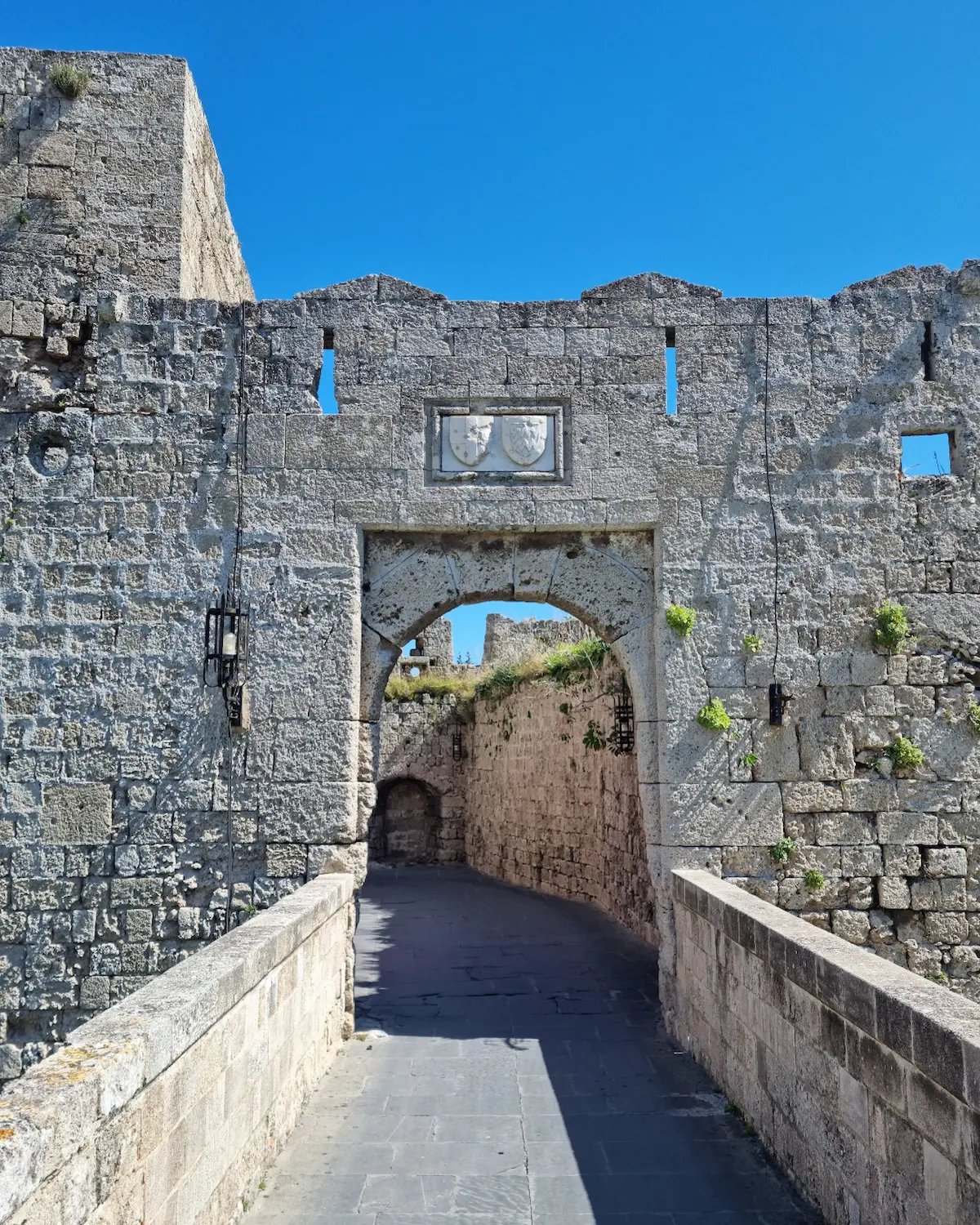 a stone wall with a clock on it