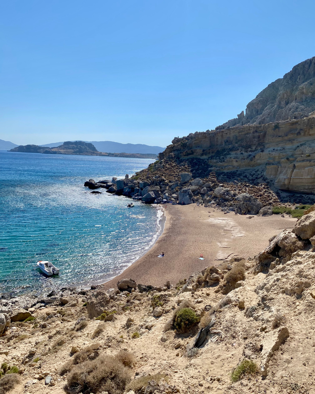 a beach with a boat in the water
