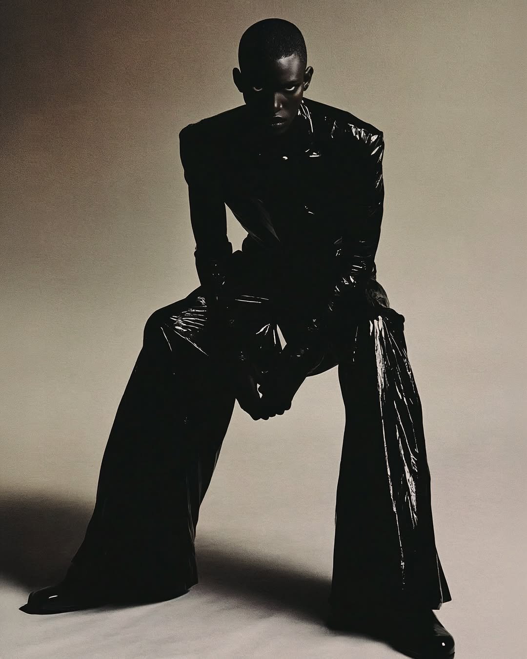 a man in a black leather jacket and black pants