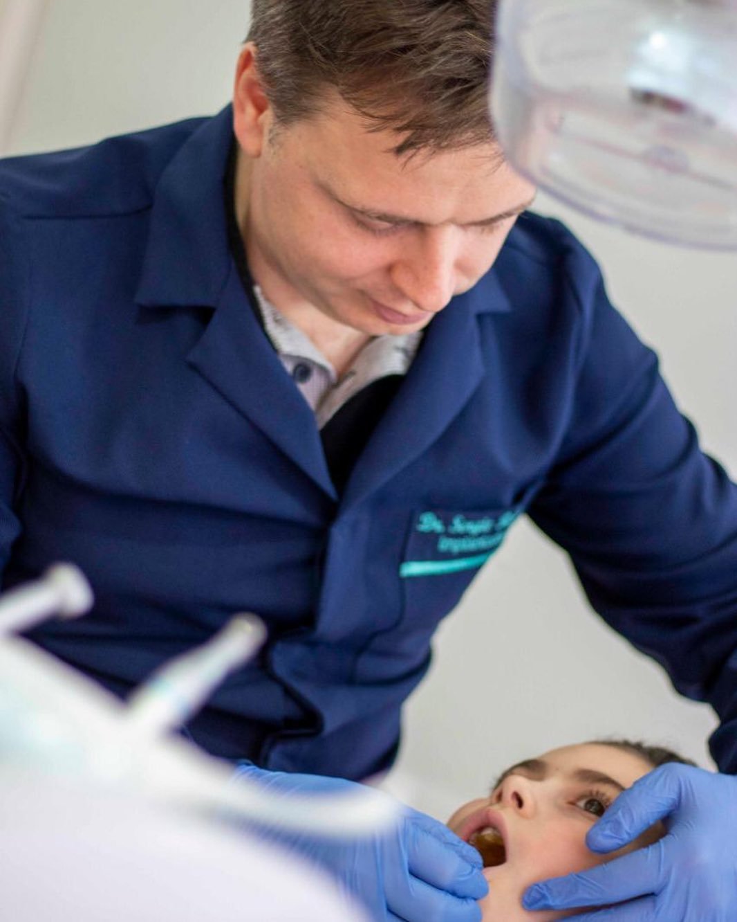 a man in a blue jacket is getting ready to go to the dentist