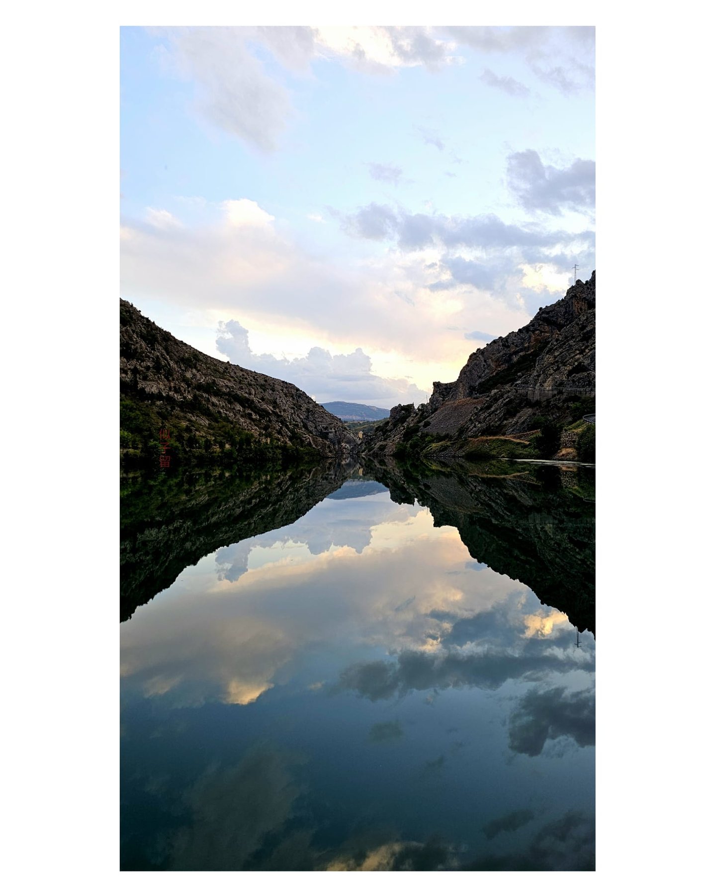 Nearly Perfect Mirror Reflection of the Embassament de Sopeira photographed by NIKORU