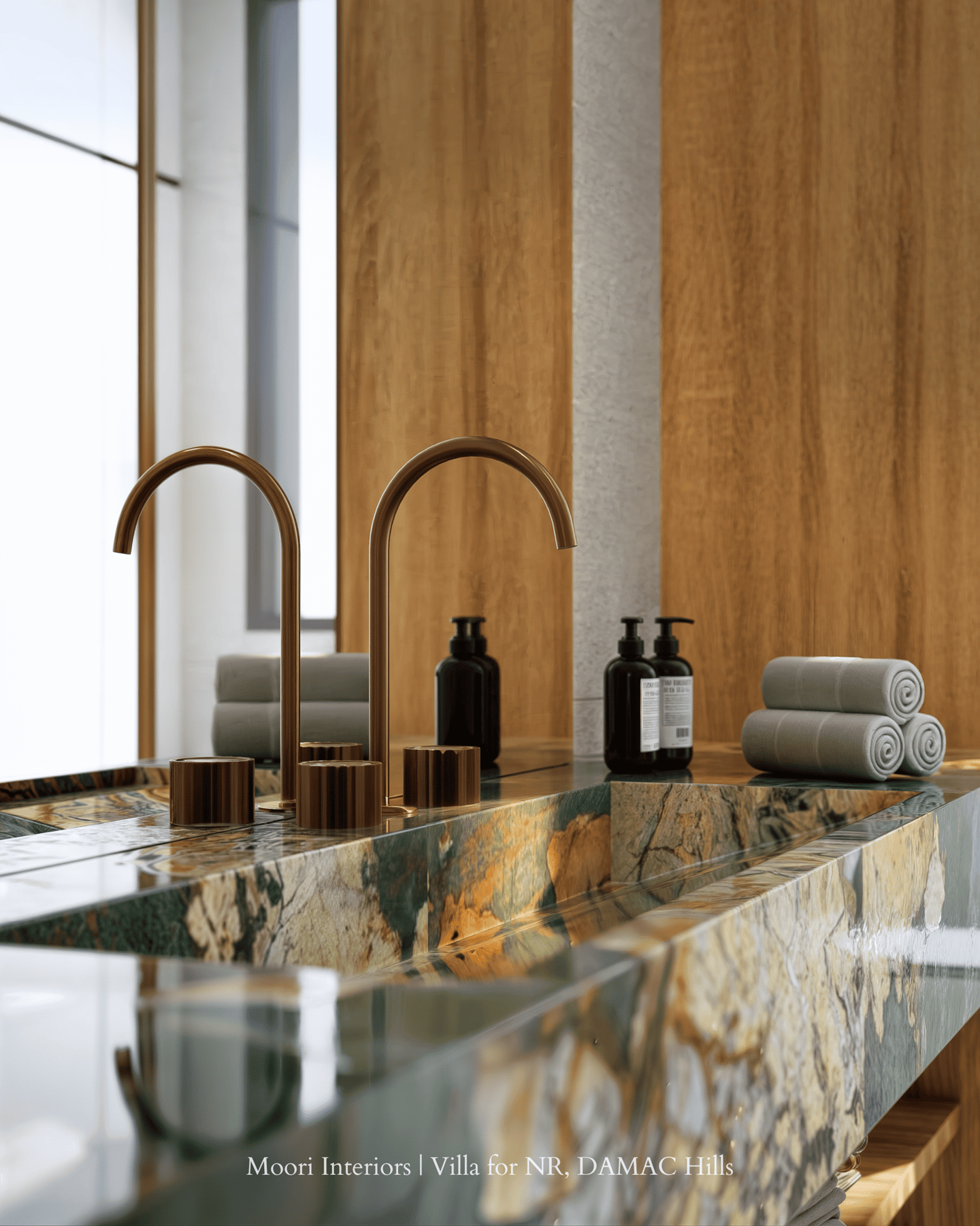 Elegant sink area in a Dubai bathroom with a unique marble pattern and gold faucets.