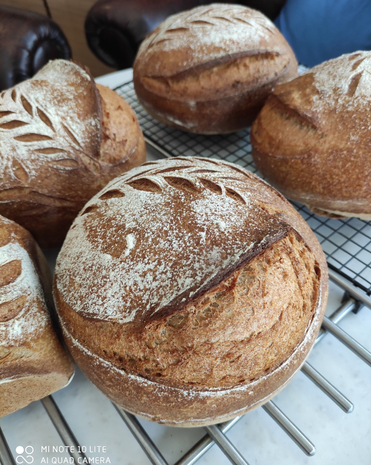 A  table with freshly baked sourdough bread and  in a cozy cafe setting.