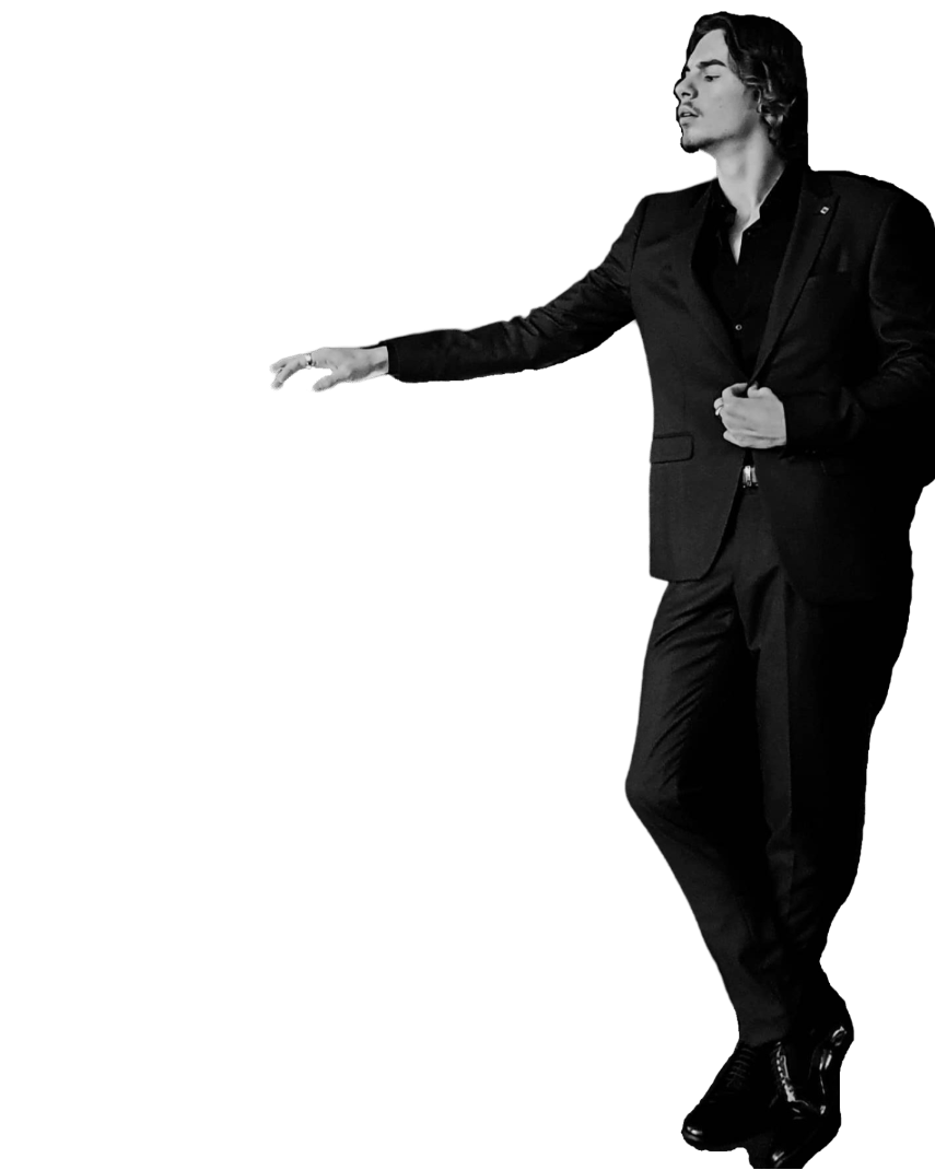 a man in a suit and shoes standing in a black and white photo