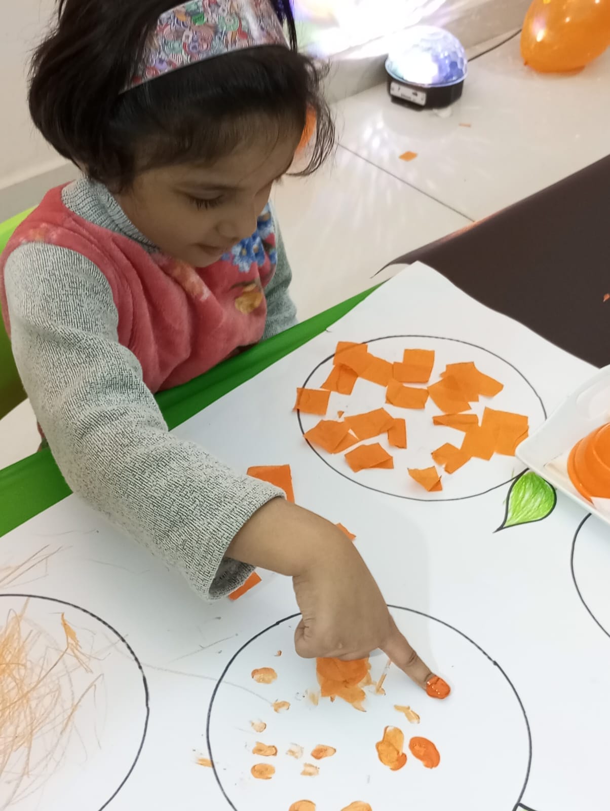 Child enjoying tactile play with sensory materials