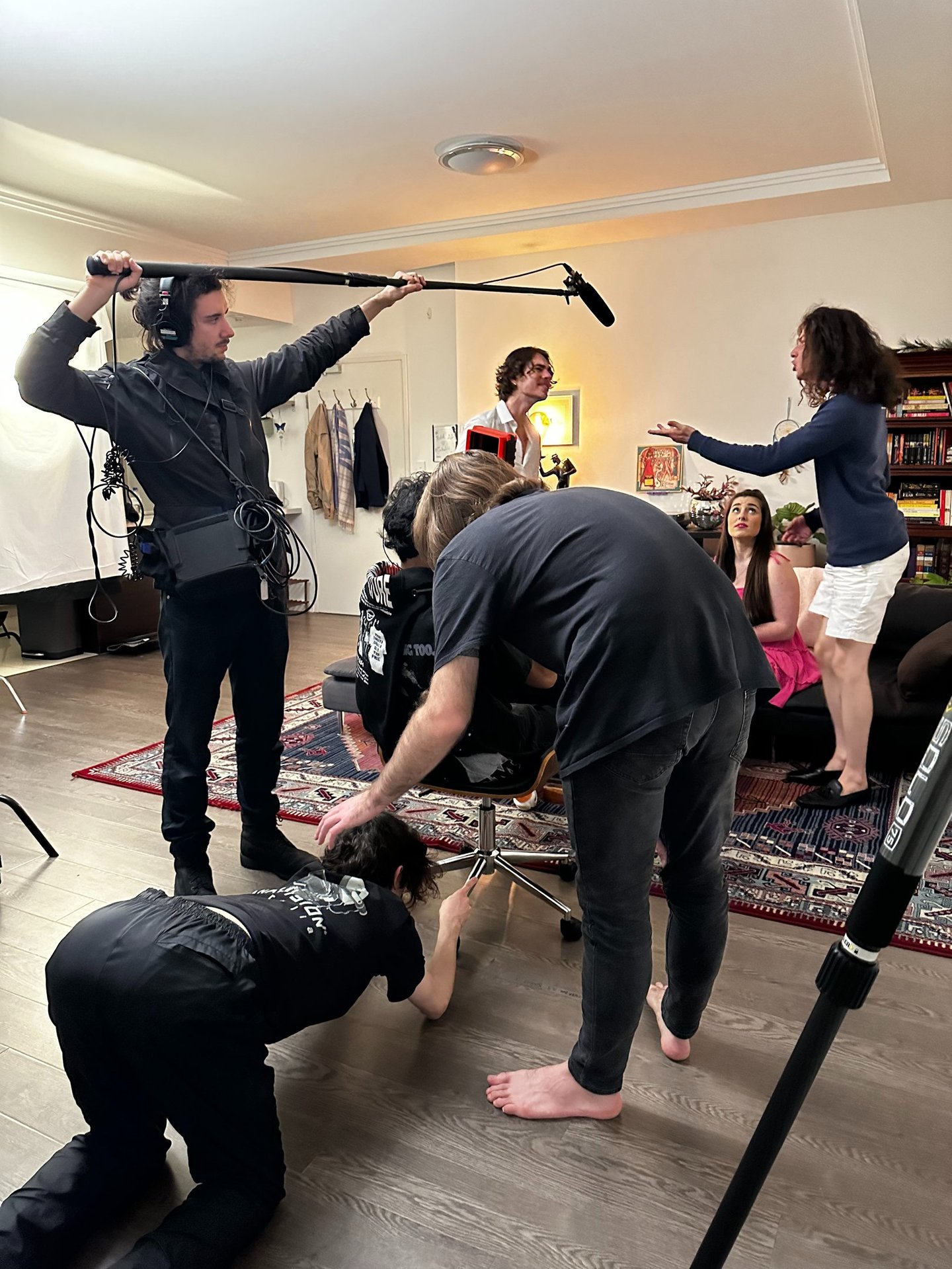 a man is filming a video camera and another is filming a video