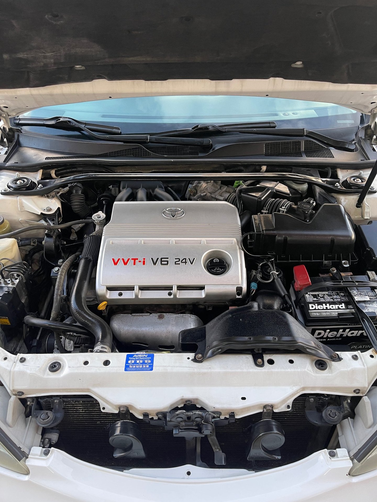Engine bay detailing service in Logan Ohio with clean and restored components
