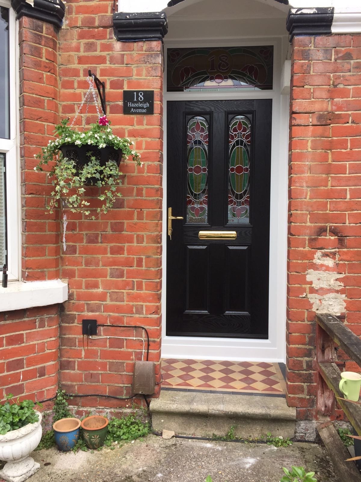 new black front door with bespoke glass which was fitted in Woolston, Southampton by Buildmydoor