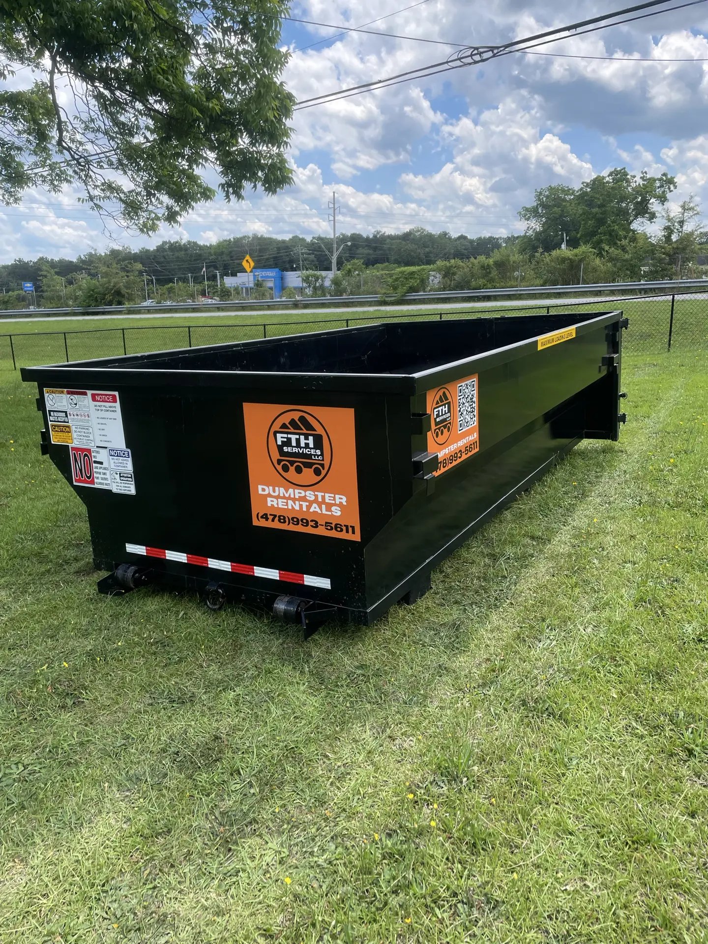 Dumpster rental in Forsyth, GA — roll-off placed in residential yard