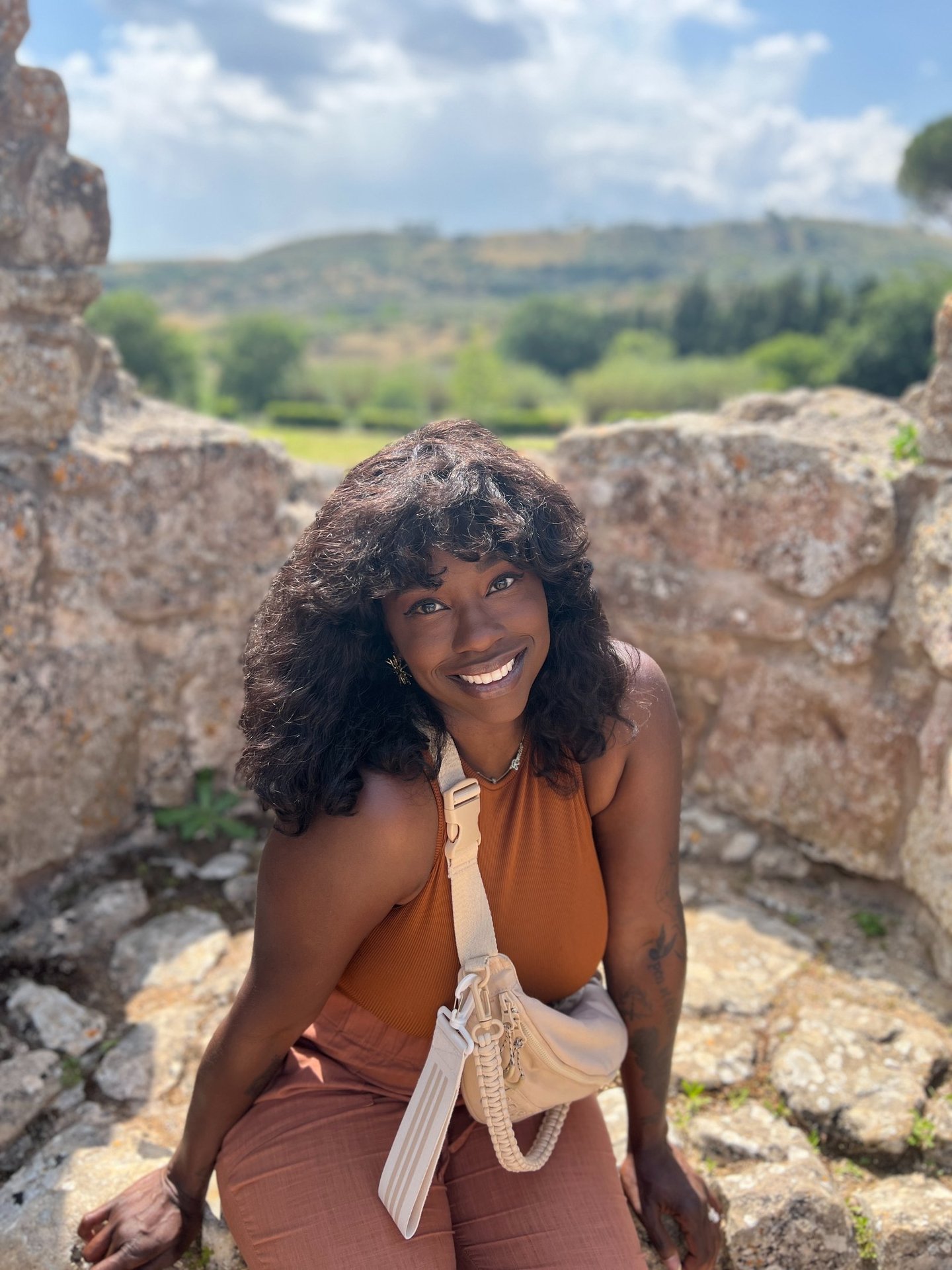 a woman in a tan top