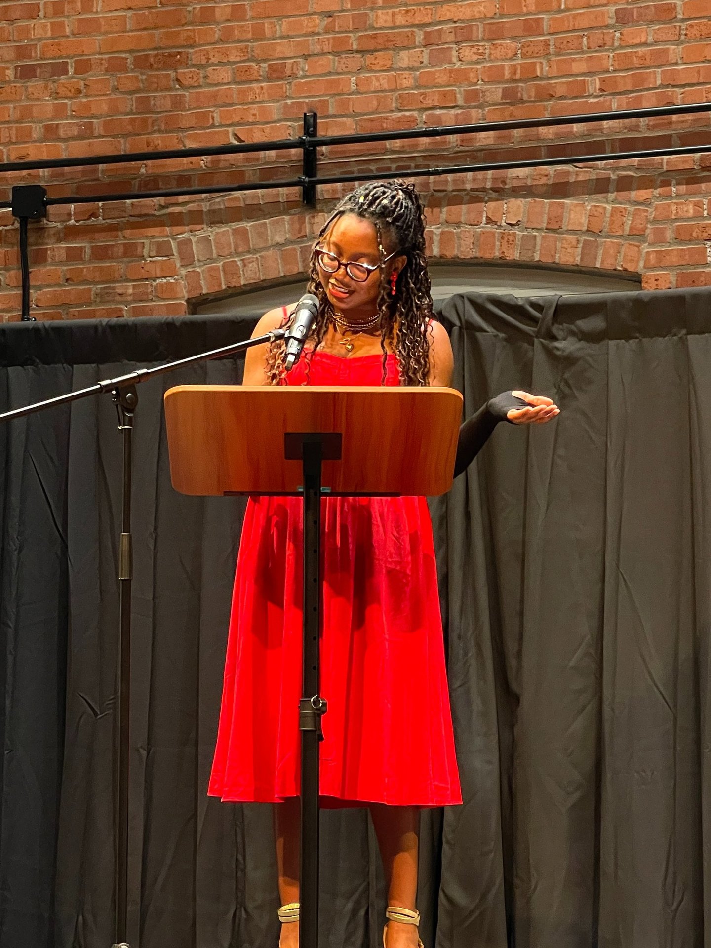 Iheoma Uzomba reads poetry at the 2025 Writers Guild of Alberta Mentorship program