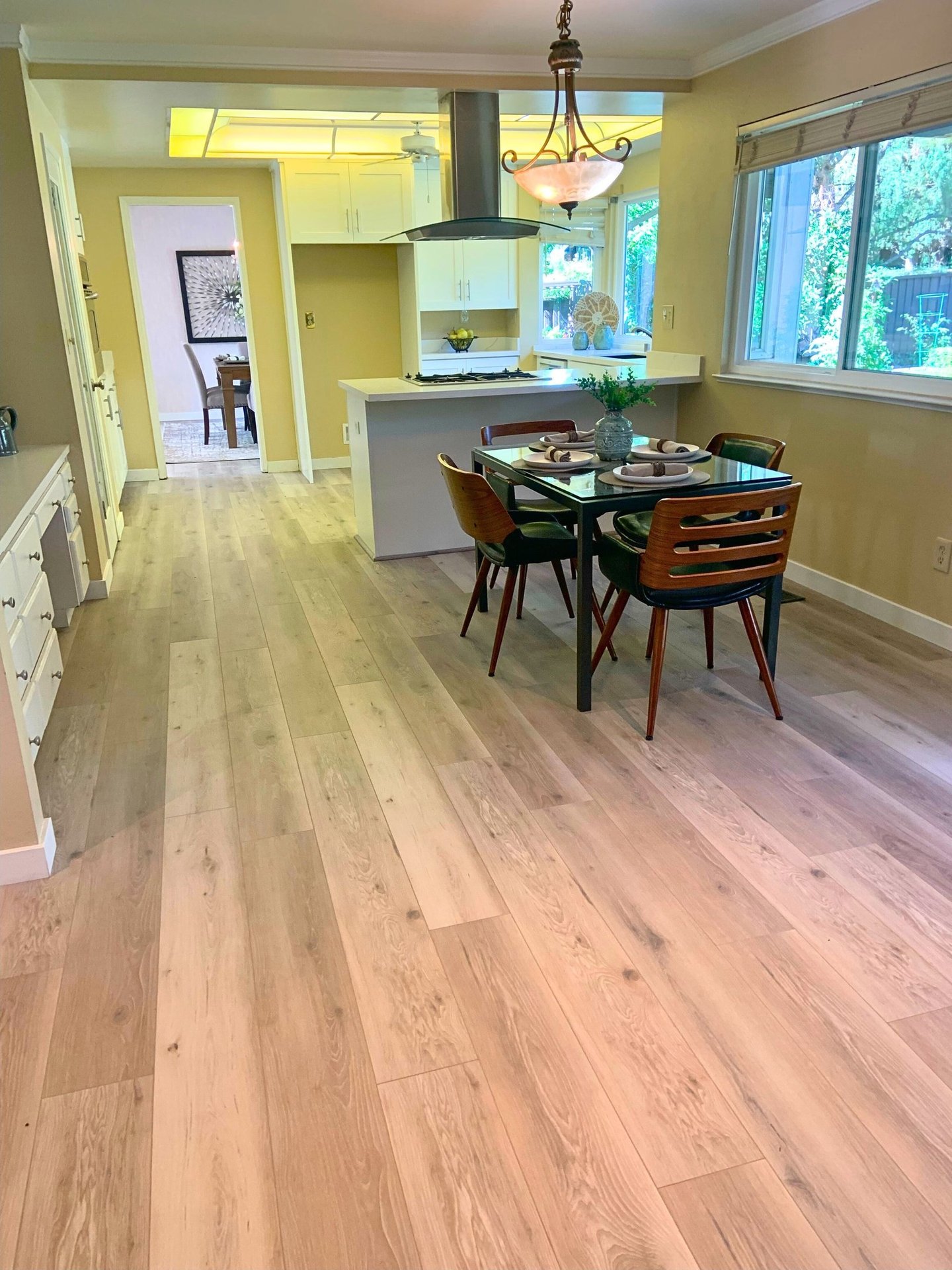 a dining room with a table and chairs